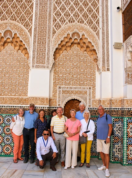 Group of travelers experiencing Moroccan architecture on a guided tour